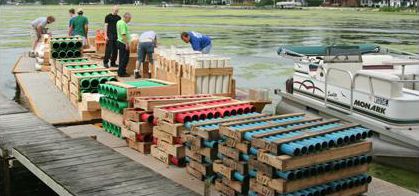 Loading up the barges with racks of cannisters